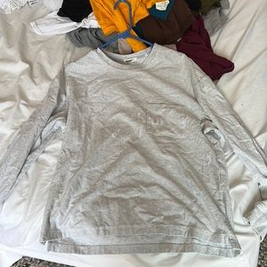 Kith Long Sleeve Sweatshirt in Gray with front pocket with Kith Logo.